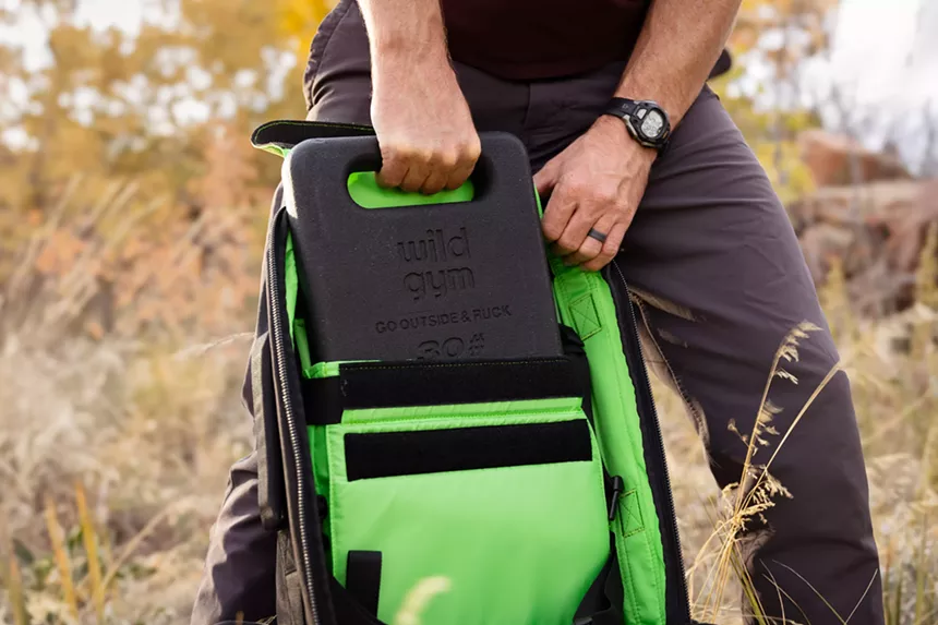 A bright green backpack and metal plate