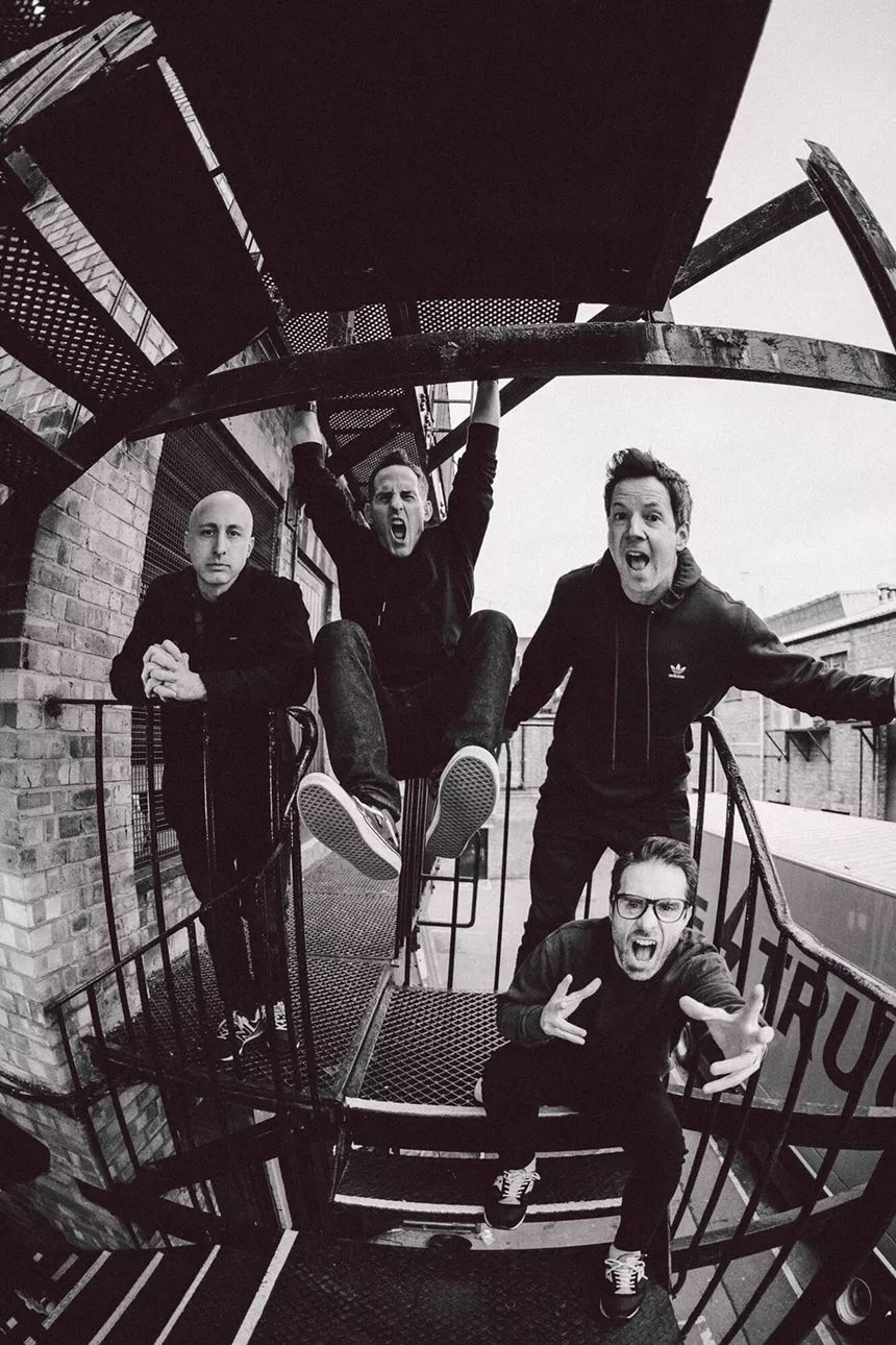 members of Simple Plan goofing around