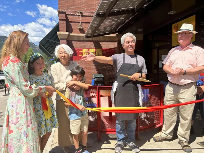 people at a ribbon cutting