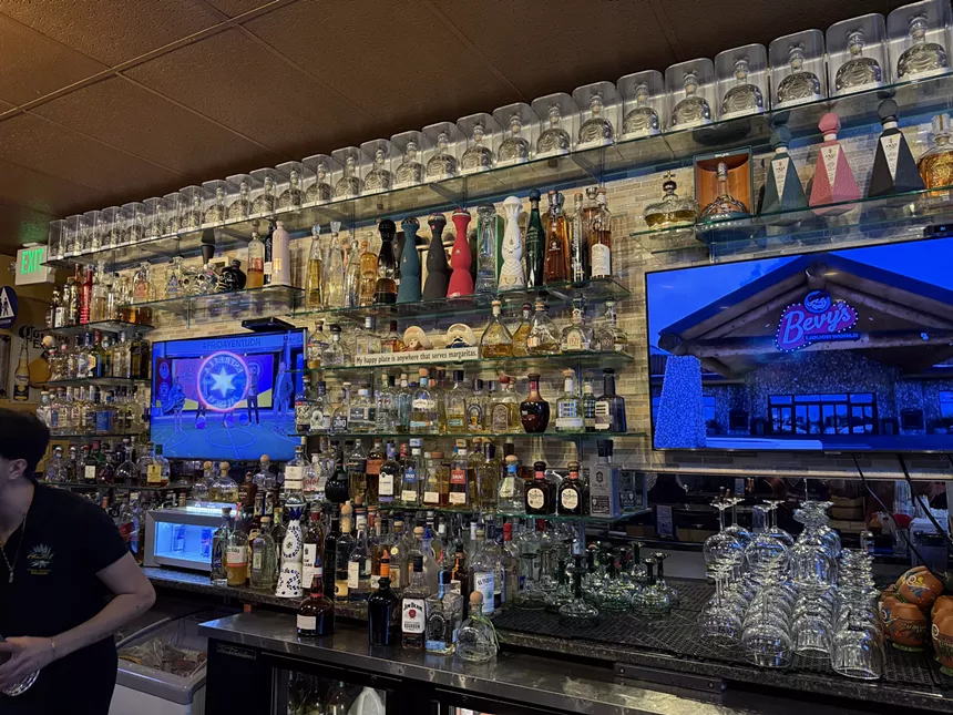 tequila bottles lining a bar