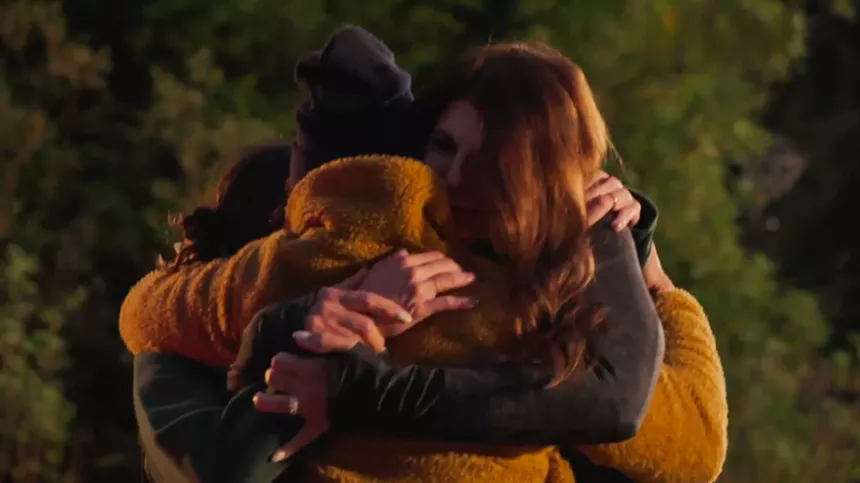 Hyak and her family embracing shortly after being reunited