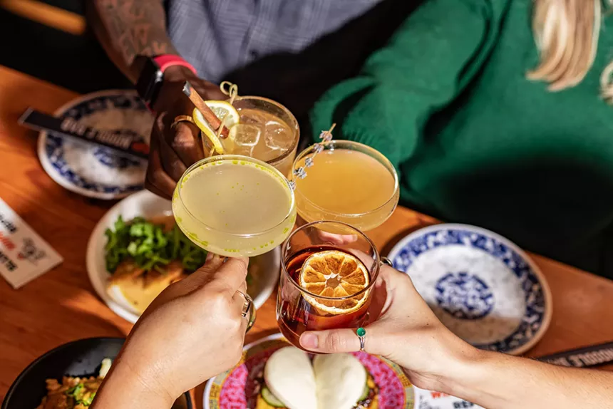 handing holding various cocktails