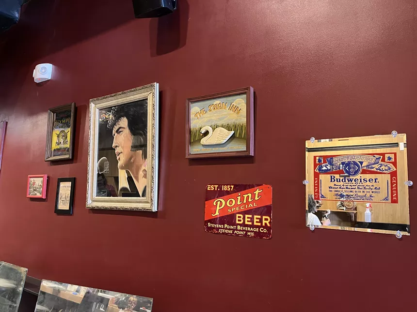 art on a maroon wall