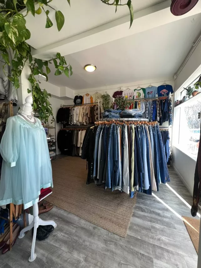 A store with racks of vintage clothing