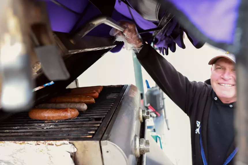hot dogs on a grill