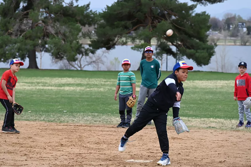 A kid throws a ball.