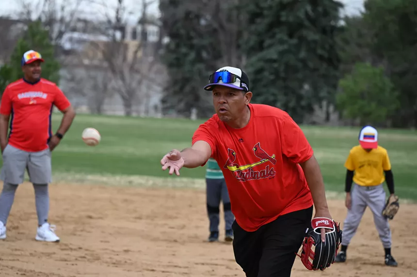 A man toss a ball.