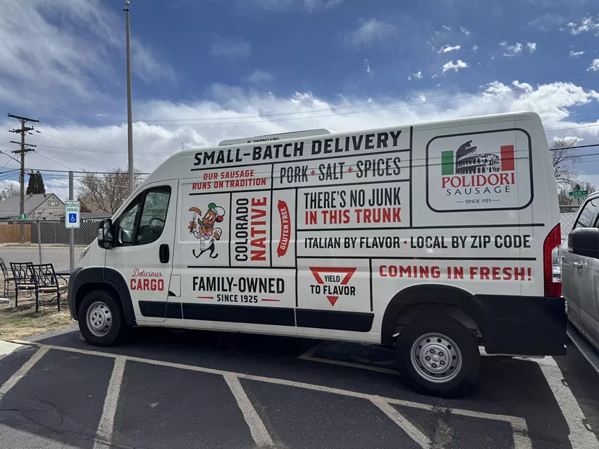 van covered with sausage slogans