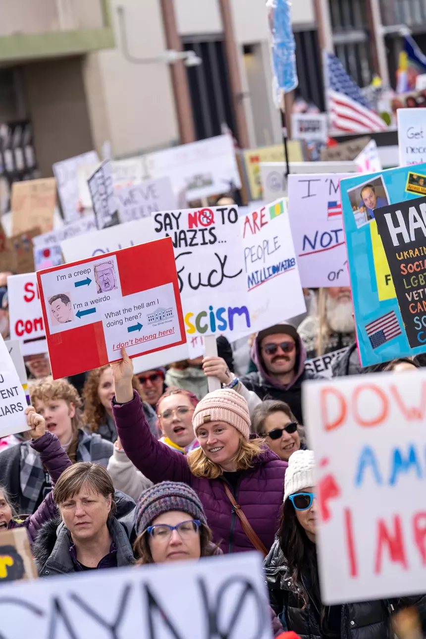 protesters holding signs