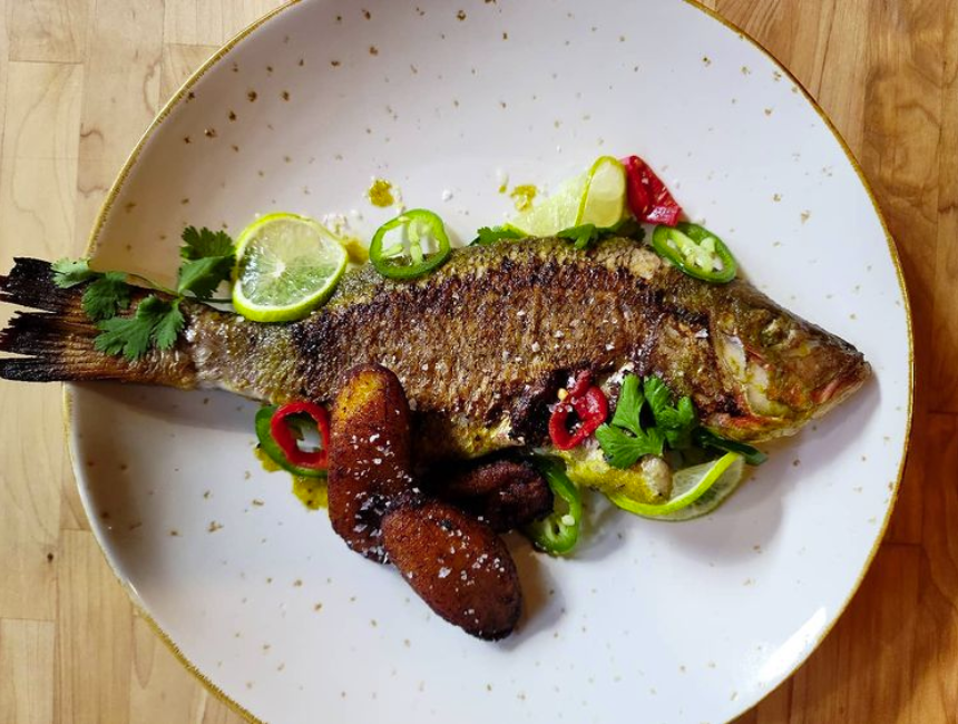 A roasted fish on a plate