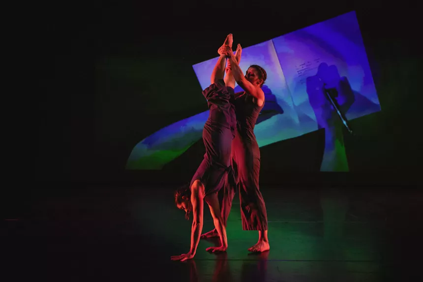 Onstage, there are two dancers.