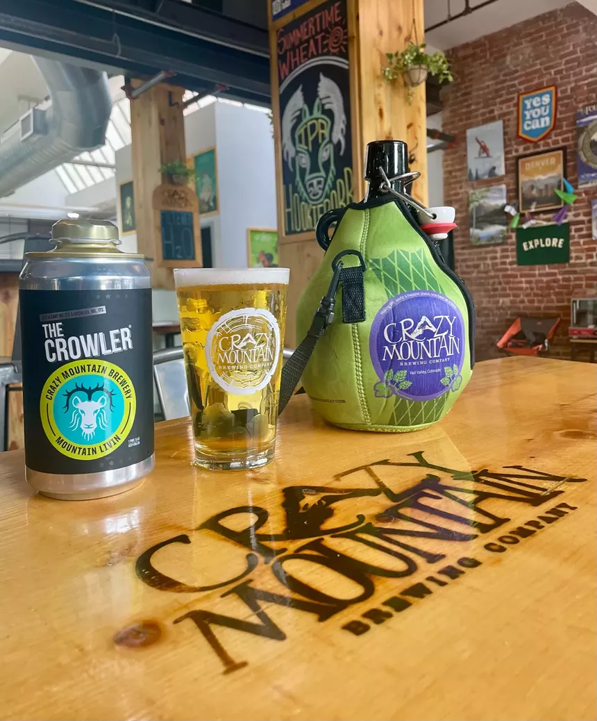 Glass growlers and aluminium crowlers at a brewery.