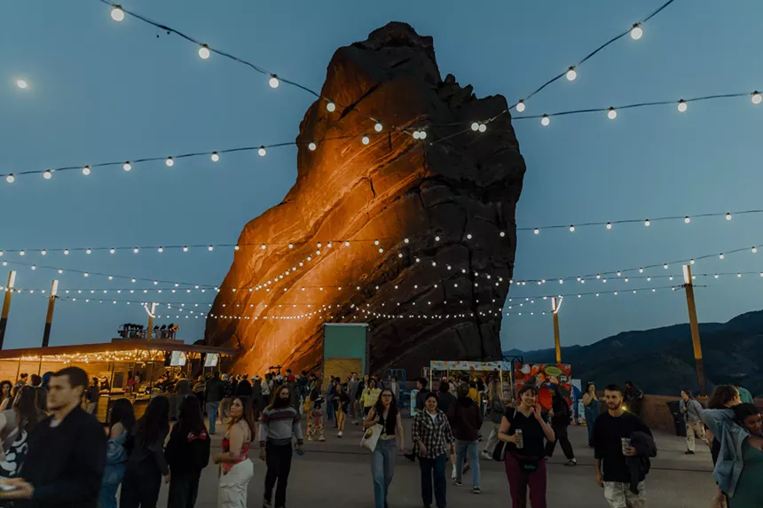 A picture of the top of Red Rocks with people walking around.