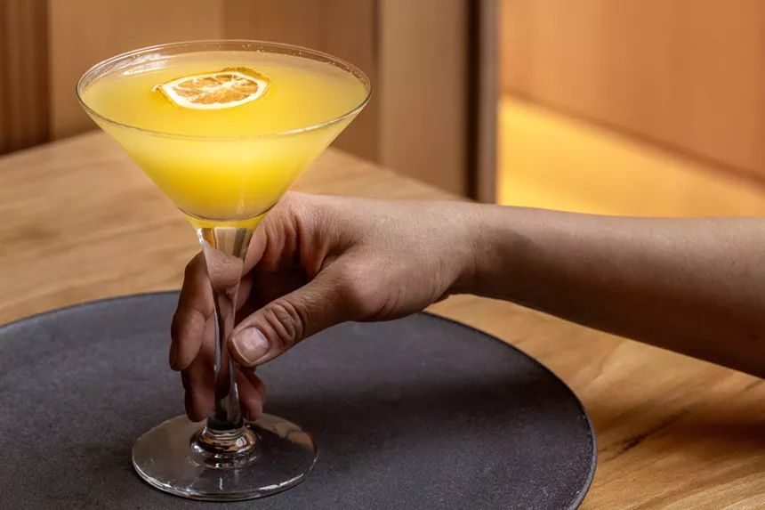 An orange-hued signature cocktail from Kizaki