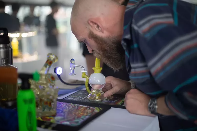 Man takes dab of hash rosin