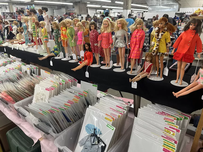 A line of vintage Barbies on display