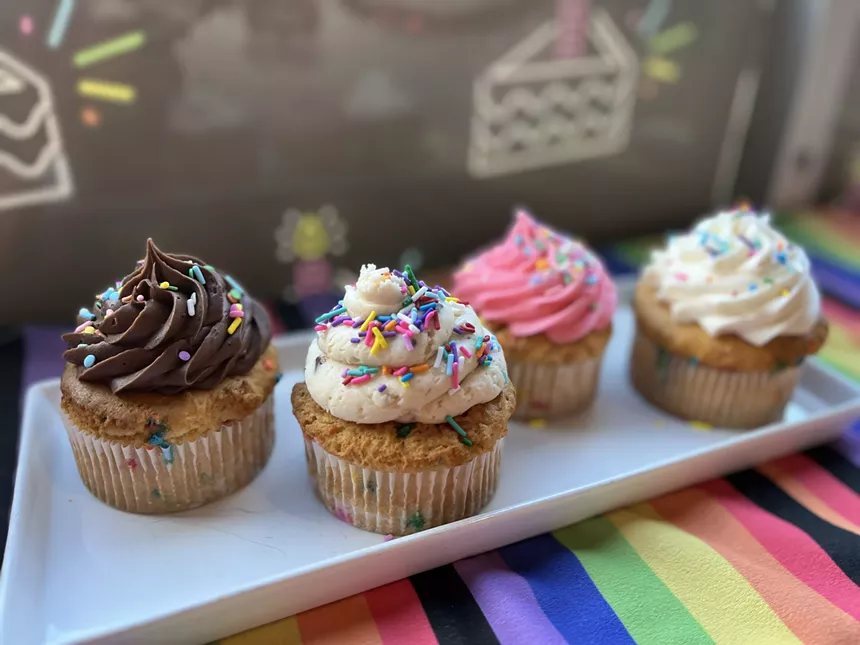 A shelf of cupcakes
