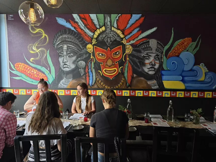 a colorful mural on an interior wall