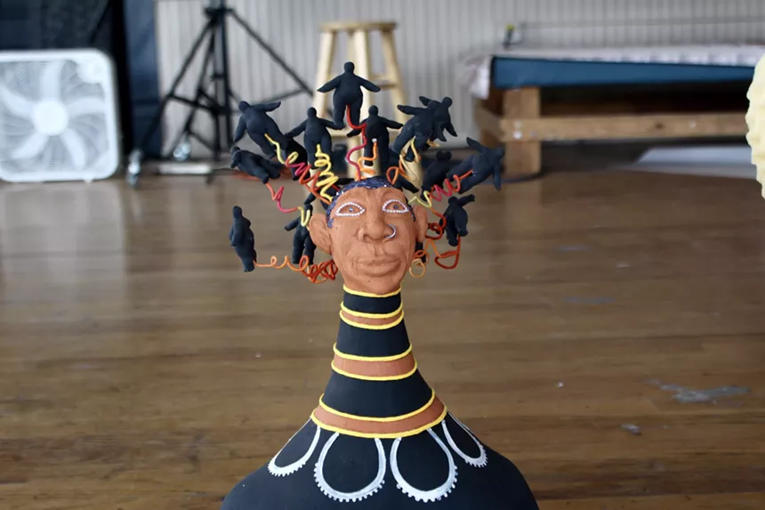 A clay figure of a woman