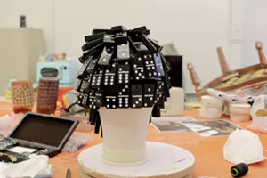 A wig made out of dominoes