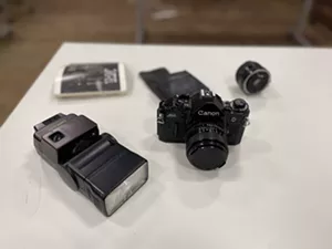 Camera parts on a table.