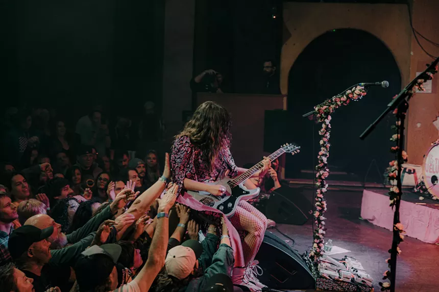 A photo showing Demi Demitro beginning to crowd surf.