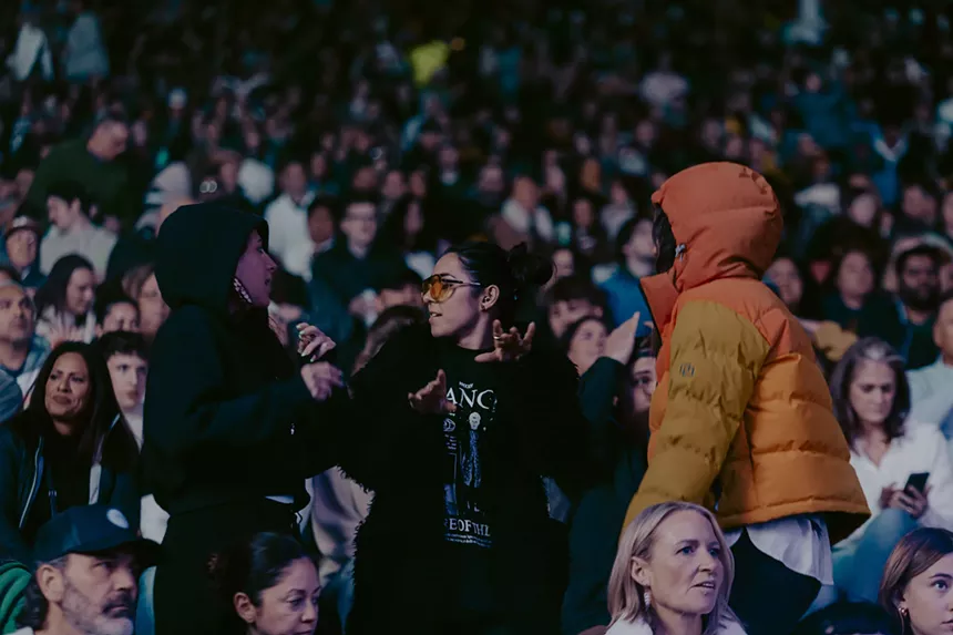Concertgoers dancing at Red Rocks.