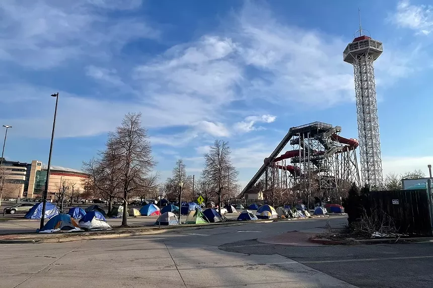A migrant encampment outside of Elitch Gardens has upwards of 60 people.