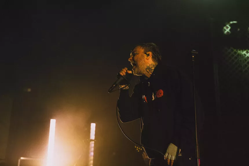 Bert McCracken, lead singer of The Used, performing on stage at the Ogden Theatre.