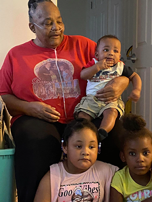 Grandmother holds grandchildren