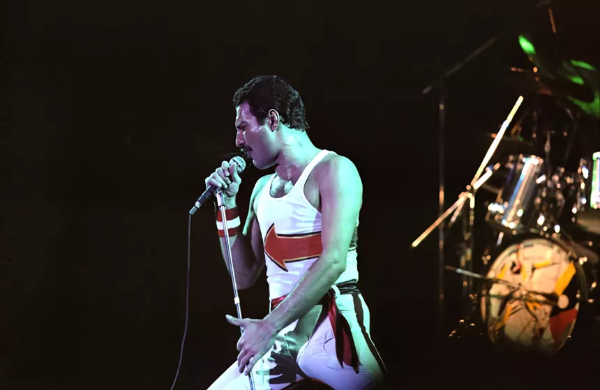 Freddie Mercury performing on stage