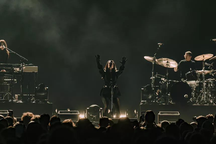 St. Vincent performing on stage at the Mission Ballroom in Denver, Colorado.