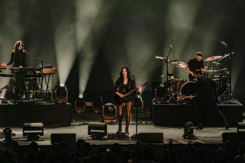 St. Vincent performing on stage.
