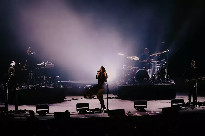 St. Vincent performing on stage at the Mission Ballroom in Denver, Colorado.