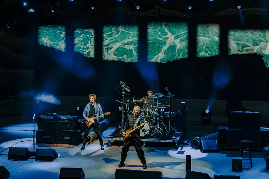 Sting performing on stage at Red Rocks with his new trio band.