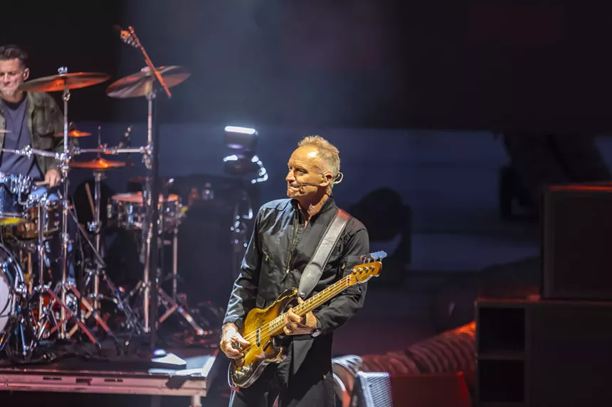 Sting performing on stage at Red Rocks with his new trio band.