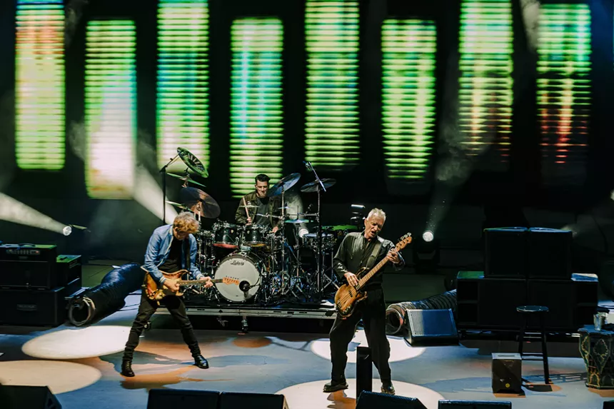 Sting rocking out on stage at Red Rocks.