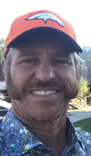 man in baseball hat