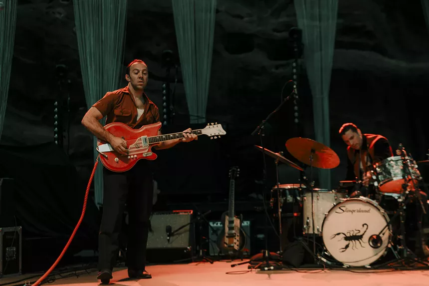 LA LOM performing on stage at Red Rocks.