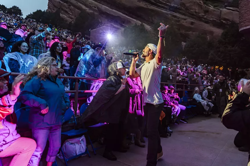 Walker Hayes performing near the crowd at Red Rocks.