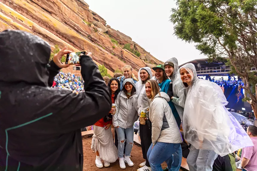 A photo showing fans at Red Rocks gathering for a group photo.