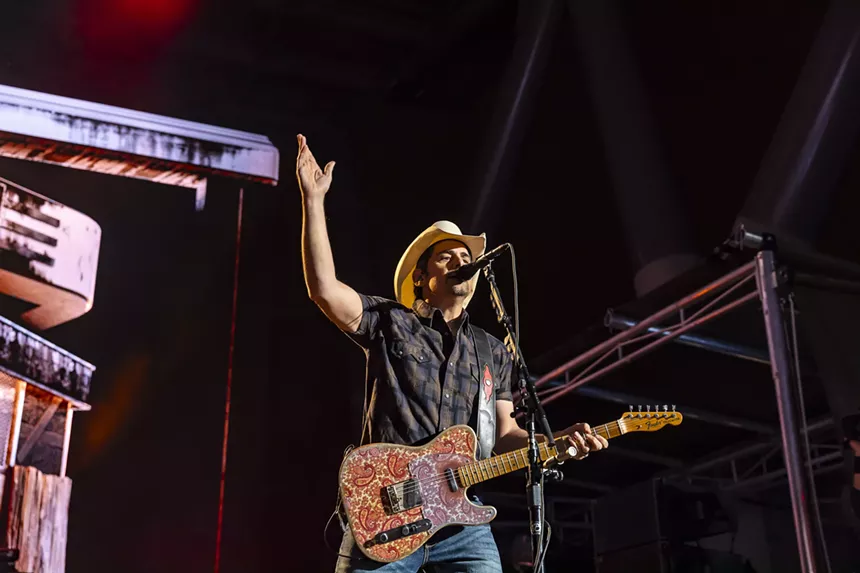 A photo showing Brad Paisley on stage at Red Rocks.
