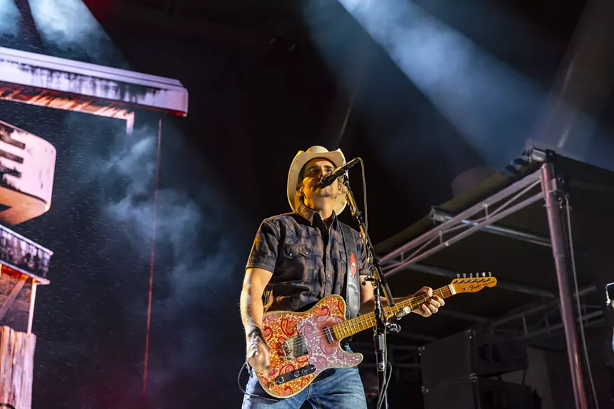 A photo showing Brad Paisley on stage at Red Rocks.