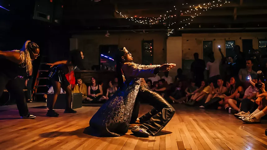 A dancer performs for an audience.