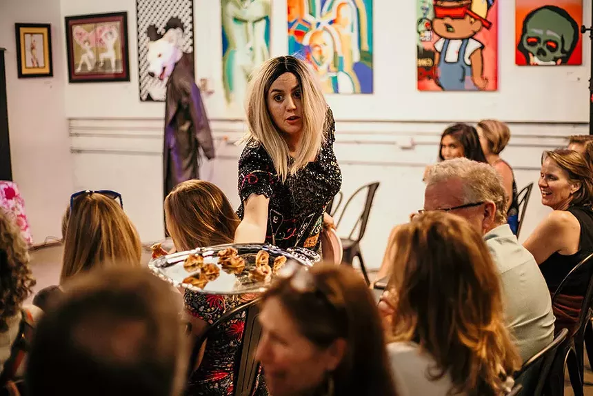 An immersive performer moves throughout the audience.