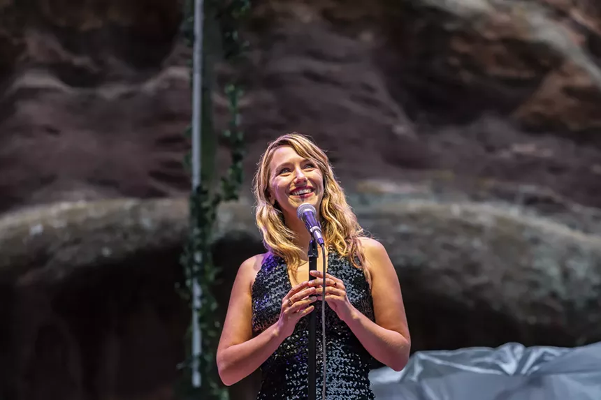A photo of Molly Lewis performing at Red Rocks.