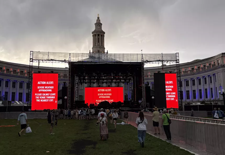 A stage and messages warning audience members to exit the venue