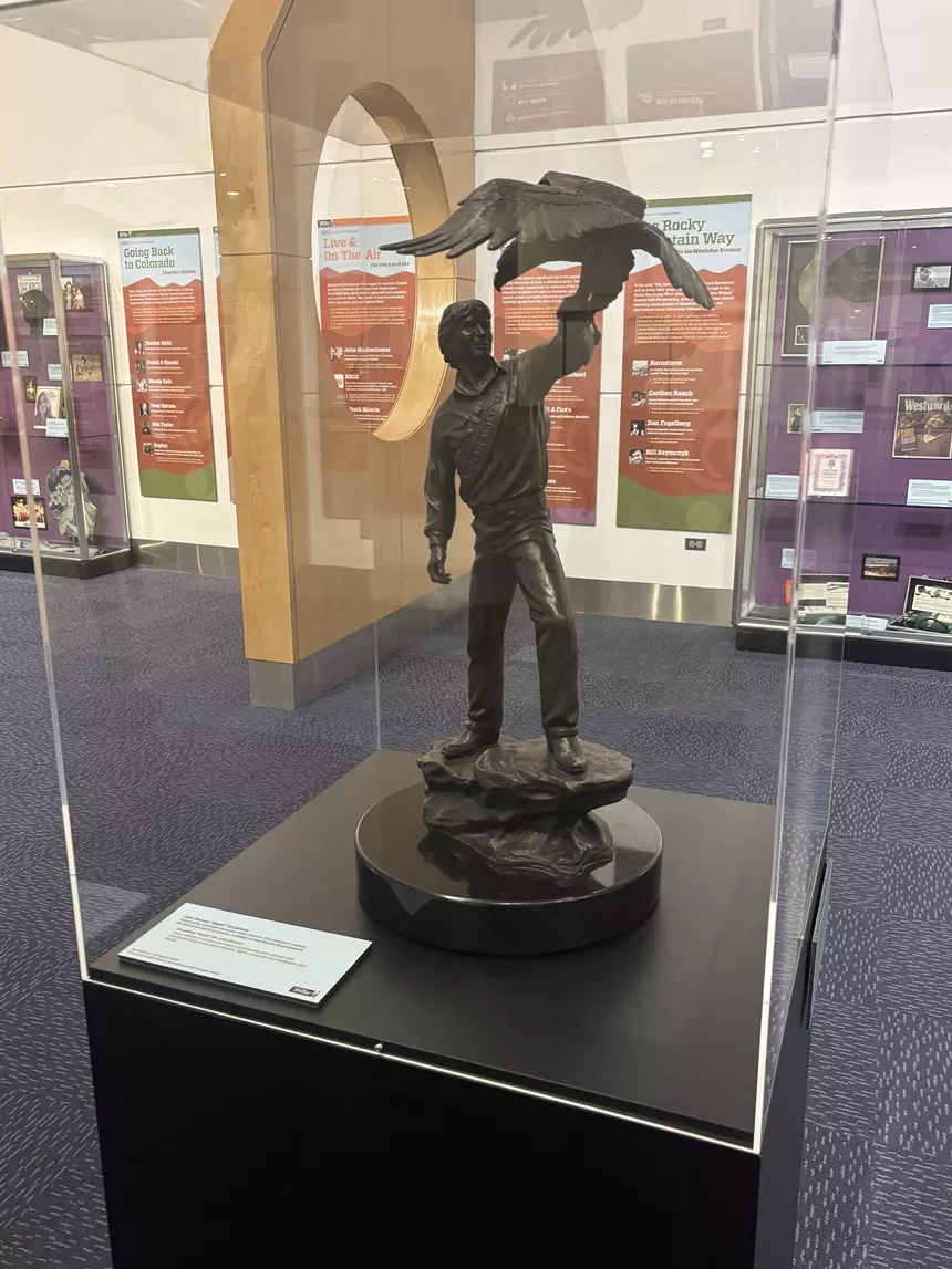 sculpture of man with bird