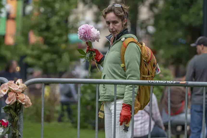 woman looks for place to put flowers