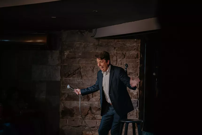 A comedian performs on stage at Comedy Works.